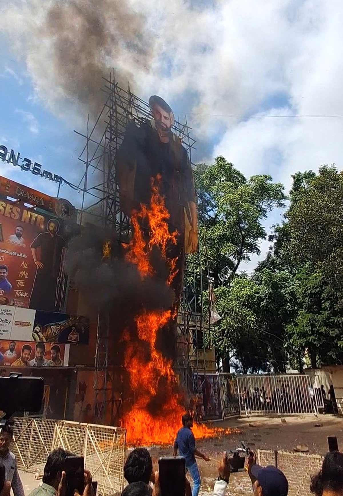 Angry fans torch NTR cutout at Sudarshan theatre