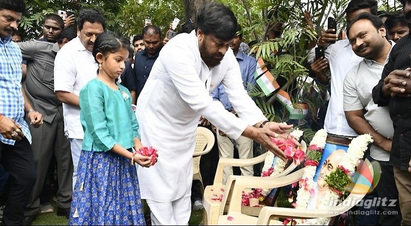 Chiru hoists flags, appreciates two fans for a reason