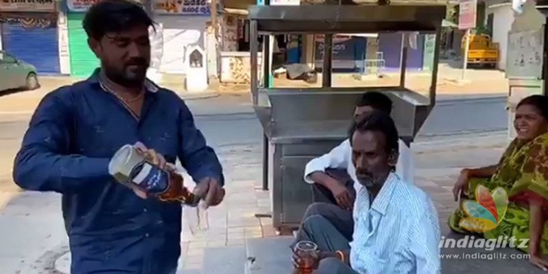 Man in Telangana distributes liquor to migrant workers